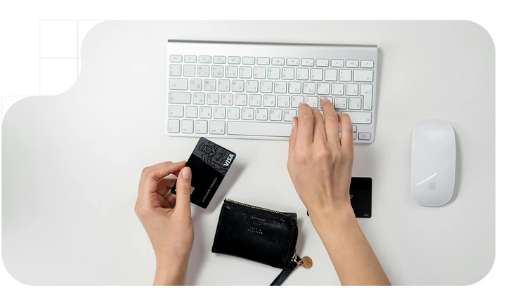 Woman entering her bank card details on a website, in accordance with European regulations such as DORA