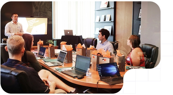 Executive showing his colleages the company´s new software to comply with the sitxth AML directive