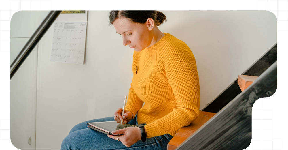 A woman online signing with a tablet