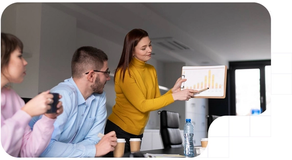 Work team in a meeting analyzing trends that will transform sales processes in a modern office.